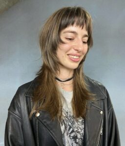 Long Butterfly Wolf cut with heavy face-framing layers and 90s-inspired blowout volume, a popular request at Assort Osaka international hair salon.