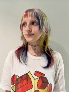 A sophisticated 'Soft Rebellion' wolf cut with seamless invisible layers and a sleek finish, styled at Assort Osaka hair salon for a modern professional look.