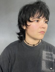 A trendy Bixie Wolf haircut—a hybrid of a pixie and a shag—featuring choppy crown layers and a textured nape, styled at Assort Osaka.