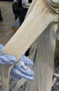 Professional bleach application at Assort Osaka to create a clean blonde base.