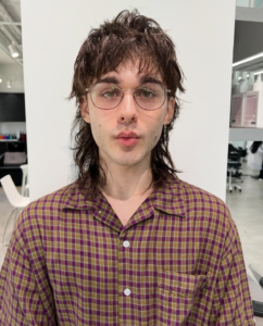 Medium shot of the original classic mullet haircut with soft, feathered layers and a natural flow from the fringe to the back, showcasing a timeless Osaka street-style aesthetic.
