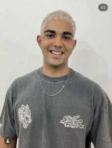 Clean, editorial solid platinum blonde buzz cut for men, a top 2026 hair trend at Assort Osaka.